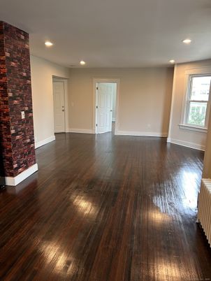 Empty room, Fireplace, Interior, Recessed Lighting, Stone Walls, Wood Texture Flooring