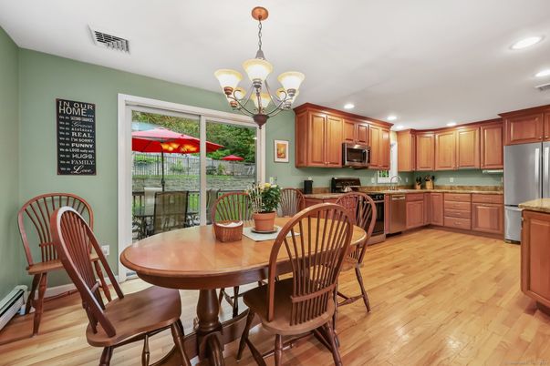 Chandelier, Dining room, Interior, Kitchen, Recessed Lighting, Stainless Steel Appliances, Wood Texture Flooring