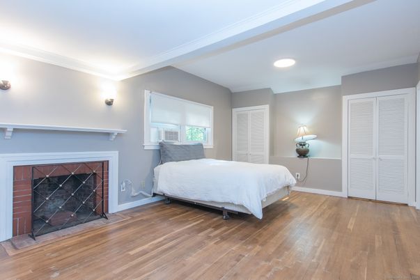 Bedroom, Fireplace, Interior, Recessed Lighting, Wood Texture Flooring