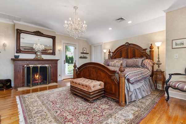 Bedroom, Chandelier, Fireplace, Interior, Recessed Lighting, Wood Texture Flooring