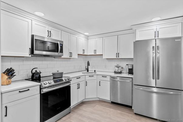 Interior, Kitchen, Recessed Lighting, Stainless Steel Appliances, Wood Texture Flooring