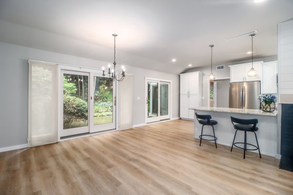 Empty room, Interior, Kitchen, Pendant Lights, Recessed Lighting, Stainless Steel Appliances, Wood Texture Flooring