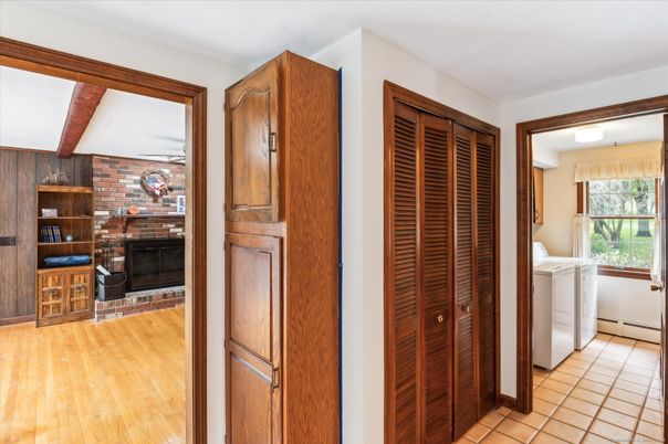Fireplace, Interior, Stone Walls, Washer, Wood Texture Flooring
