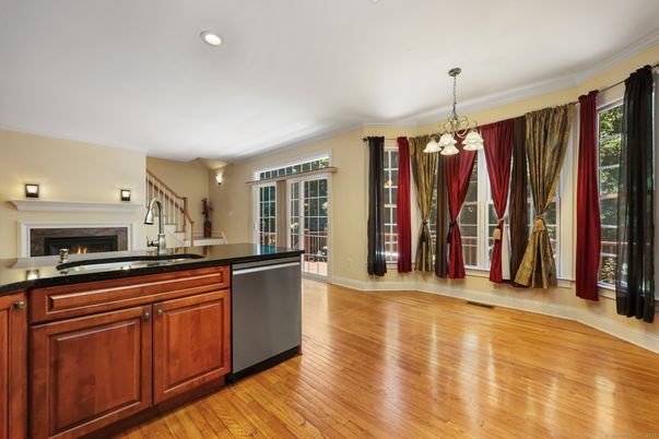 Chandelier, Fireplace, Interior, Kitchen, Pendant Lights, Recessed Lighting, Wood Texture Flooring