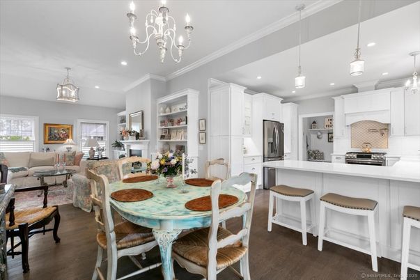Chandelier, Dining room, Interior, Kitchen, Living room, Pendant Lights, Recessed Lighting, Stainless Steel Appliances, Wood Texture Flooring