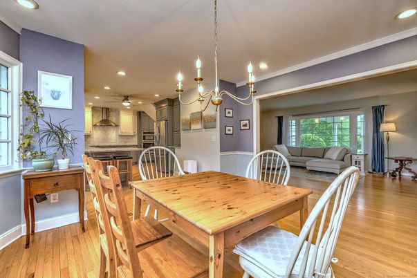 Chandelier, Dining room, Interior, Kitchen, Recessed Lighting, Stainless Steel Appliances, Wood Texture Flooring