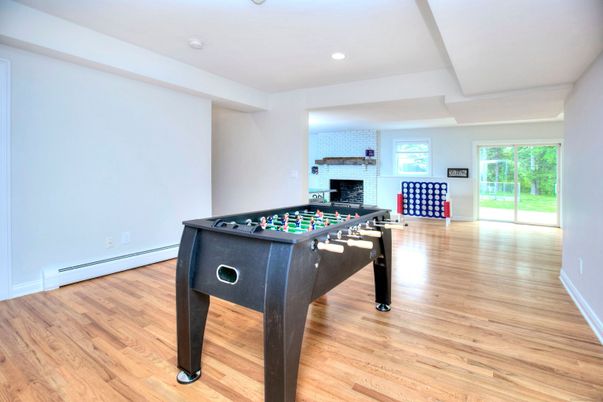 Fireplace, Game Room, Interior, Recessed Lighting, Wood Texture Flooring