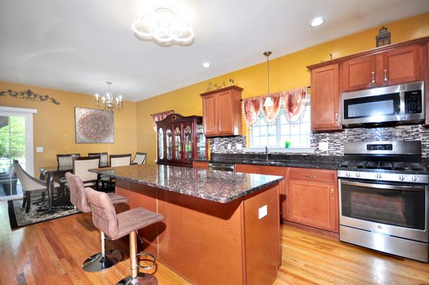Chandelier, Dining room, Interior, Kitchen, Recessed Lighting, Stainless Steel Appliances, Wood Texture Flooring