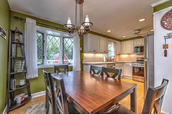 Chandelier, Dining room, Interior, Kitchen, Recessed Lighting, Stainless Steel Appliances, Wood Texture Flooring