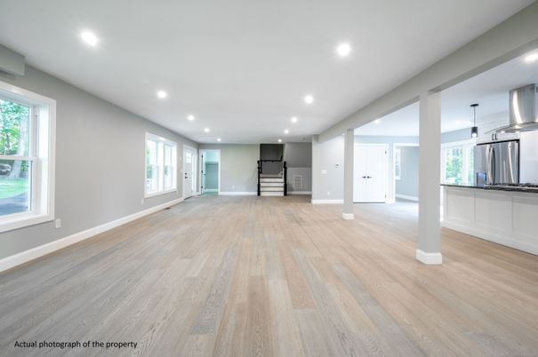 Empty room, Interior, Kitchen, Recessed Lighting, Stainless Steel Appliances, Wood Texture Flooring
