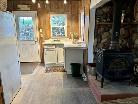 Fireplace, Interior, Kitchen, Wood Texture Flooring, Wooden Walls