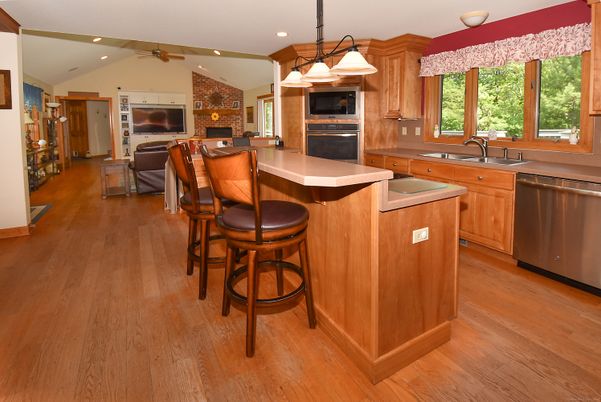 Interior, Kitchen, Pendant Lights, Recessed Lighting, Stainless Steel Appliances, Stone Walls, Wood Texture Flooring