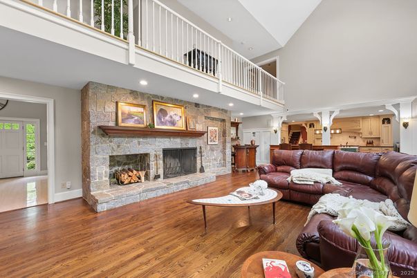 Fireplace, Interior, Living room, Recessed Lighting, Stone Walls, Wood Texture Flooring