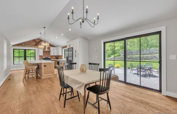 Chandelier, Dining room, Interior, Kitchen, Pendant Lights, Recessed Lighting, Stainless Steel Appliances, Wood Texture Flooring