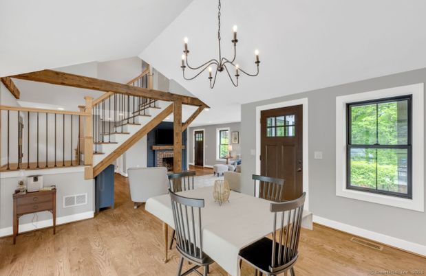 Chandelier, Dining room, Fireplace, Interior, Wooden Beams, Wood Texture Flooring