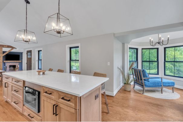 Chandelier, Dining room, Fireplace, Interior, Kitchen, Pendant Lights, Wood Texture Flooring