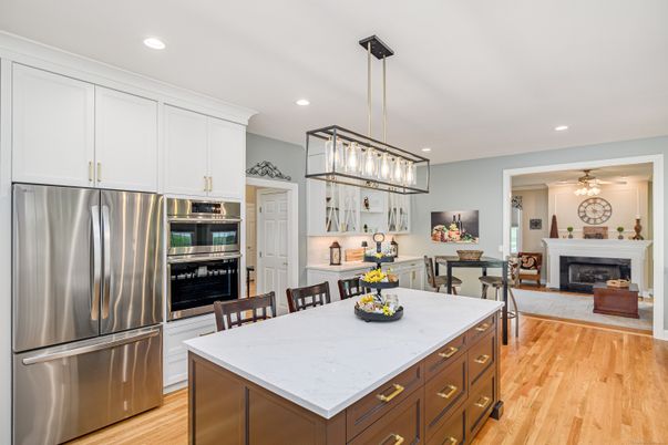 Dining room, Fireplace, Interior, Kitchen, Pendant Lights, Recessed Lighting, Stainless Steel Appliances, Wood Texture Flooring