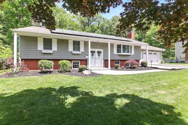 Attached, Backyard, Exterior, Facade, Solar Panels, Raised Ranch