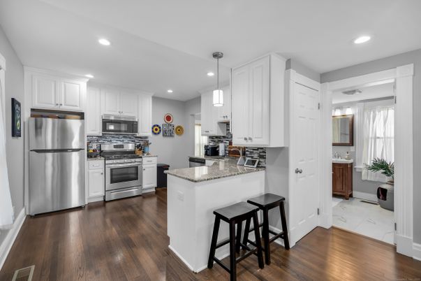 Interior, Kitchen, Pendant Lights, Recessed Lighting, Stainless Steel Appliances, Wood Texture Flooring