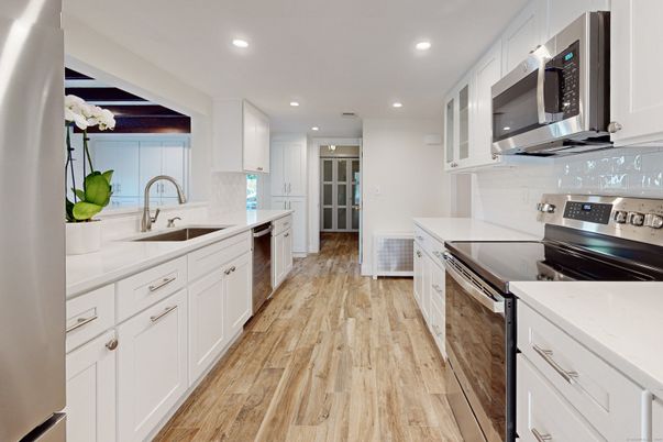 Interior, Kitchen, Recessed Lighting, Stainless Steel Appliances, Wood Texture Flooring