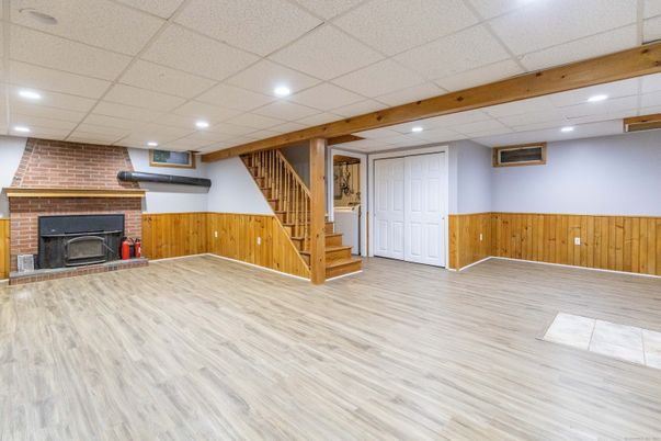 Empty room, Fireplace, Interior, Recessed Lighting, Stone Walls, Wooden Beams, Wood Texture Flooring, Wooden Walls