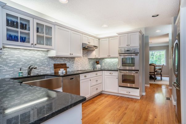 Dining room, Interior, Kitchen, Recessed Lighting, Stainless Steel Appliances, Wood Texture Flooring