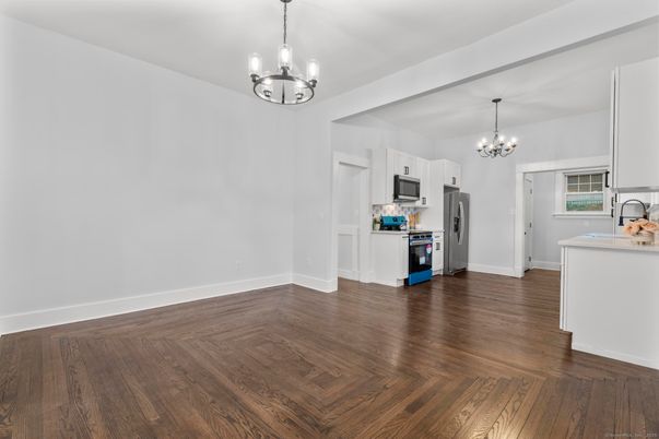 Chandelier, Empty room, Interior, Kitchen, Pendant Lights, Stainless Steel Appliances, Wood Texture Flooring