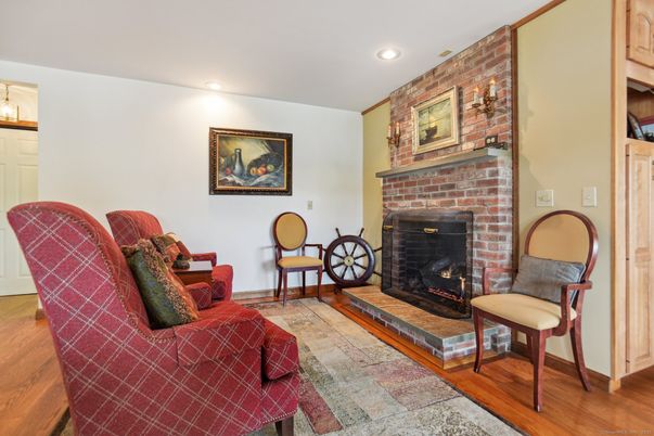 Fireplace, Interior, Living room, Recessed Lighting, Stone Walls, Wood Texture Flooring