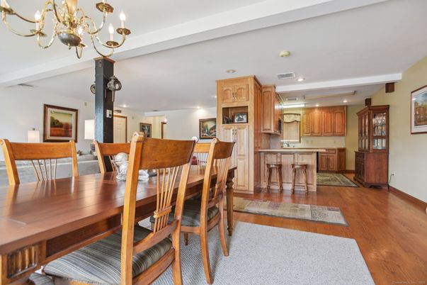 Chandelier, Dining room, Fireplace, Interior, Kitchen, Recessed Lighting, Wood Texture Flooring