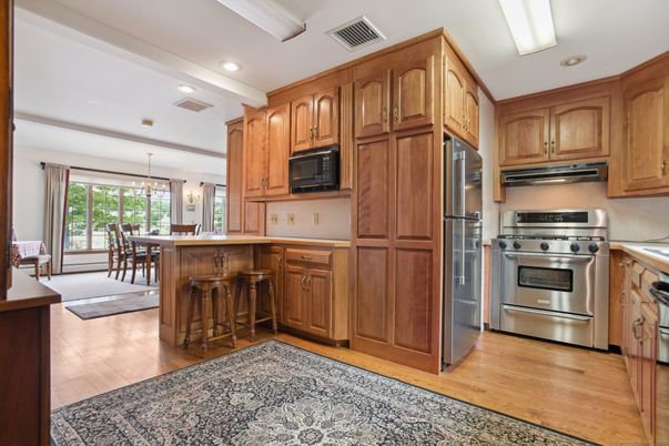 Dining room, Interior, Kitchen, Pendant Lights, Recessed Lighting, Stainless Steel Appliances, Wood Texture Flooring