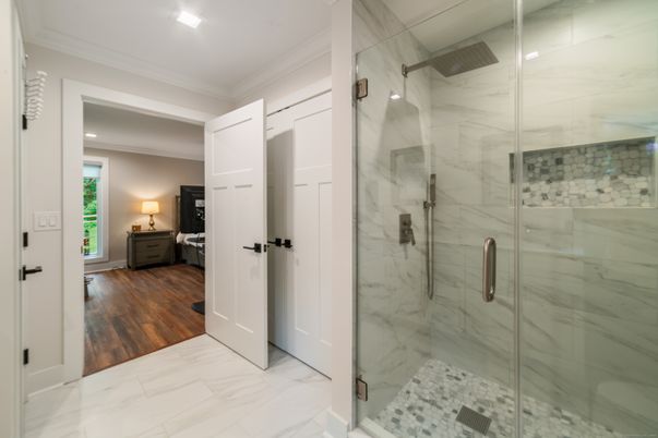Bathroom, Glass Shower, Interior, Marble, Marble Walls, Recessed Lighting, Wood Texture Flooring