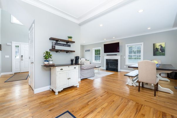 Dining room, Fireplace, Interior, Living room, Recessed Lighting, Wood Texture Flooring