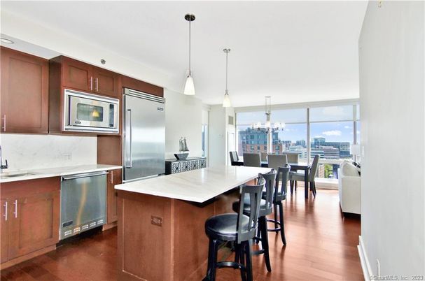 Chandelier, Dining room, Interior, Kitchen, Pendant Lights, Stainless Steel Appliances, Water, Wood Texture Flooring