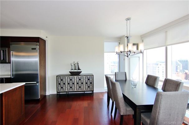 Chandelier, Dining room, Interior, Kitchen, Stainless Steel Appliances, Wood Texture Flooring