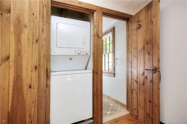 Interior, Utility Closets, Washer, Wood Texture Flooring, Wooden Walls