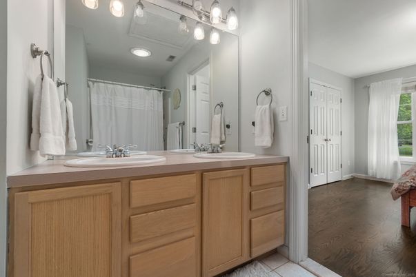 Bathroom, Dual Sink Vanities, Interior, Recessed Lighting, Wood Texture Flooring