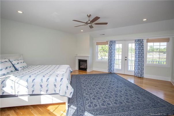 Bedroom, Fireplace, Interior, Recessed Lighting, Wood Texture Flooring