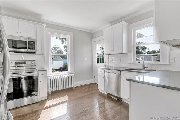 Interior, Kitchen, Recessed Lighting, Stainless Steel Appliances, Wood Texture Flooring