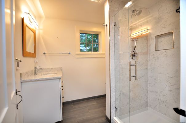 Bathroom, Glass Shower, Interior, Marble Walls, Wood Texture Flooring
