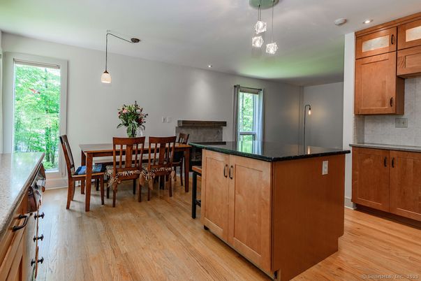 Dining room, Fireplace, Interior, Pendant Lights, Recessed Lighting, Wood Texture Flooring
