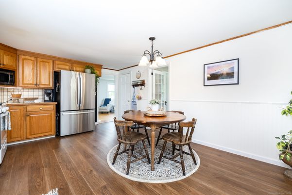 Chandelier, Dining room, Interior, Kitchen, Stainless Steel Appliances, Wood Texture Flooring