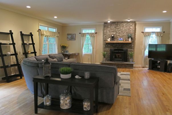Fireplace, Interior, Living room, Recessed Lighting, Stone Walls, Wood Texture Flooring