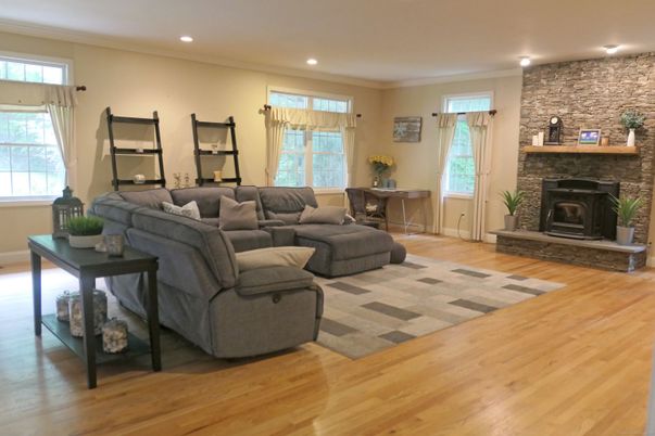 Fireplace, Interior, Living room, Recessed Lighting, Stone Walls, Wood Texture Flooring