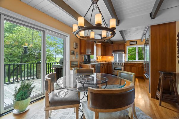 Chandelier, Dining room, Interior, Kitchen, Stainless Steel Appliances, Wooden Beams, Wood Texture Flooring