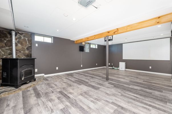 Empty room, Fireplace, Interior, Recessed Lighting, Wooden Beams, Wood Texture Flooring