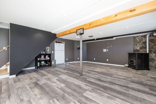 Empty room, Fireplace, Interior, Recessed Lighting, Stone Walls, Wood Texture Flooring