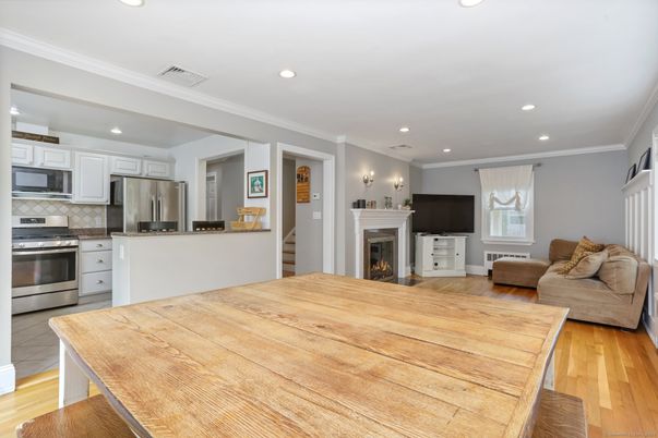 Fireplace, Interior, Kitchen, Living room, Recessed Lighting, Stainless Steel Appliances, Wood Texture Flooring