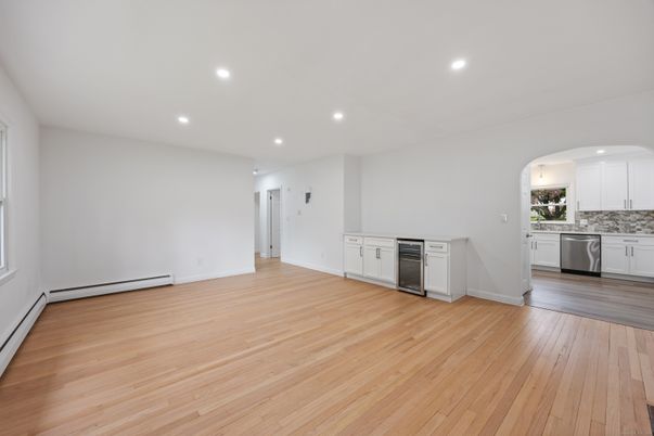 Empty room, Interior, Kitchen, Recessed Lighting, Stainless Steel Appliances, Wood Texture Flooring