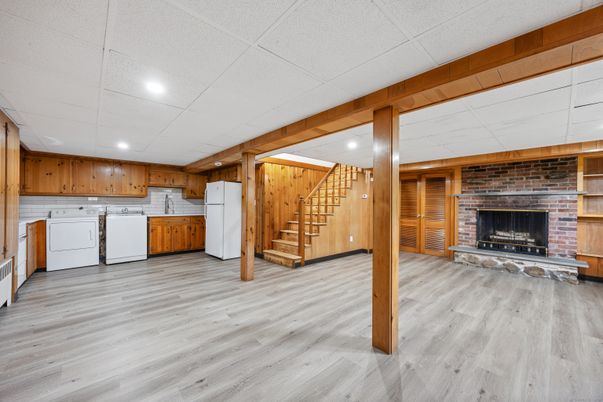 Empty room, Fireplace, Interior, Recessed Lighting, Stone Walls, Washer, Wood Texture Flooring, Wooden Walls
