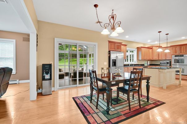 Chandelier, Dining room, Interior, Kitchen, Pendant Lights, Recessed Lighting, Stainless Steel Appliances, Wood Texture Flooring
